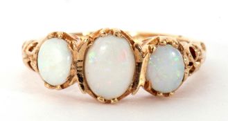 Modern 9ct gold opal ring featuring three graduated oval cabochon opals in an ornate gallery and