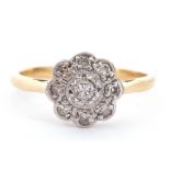 Antique diamond cluster ring, a flowerhead design centring a round brilliant cut diamond with a