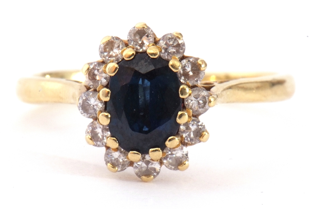 18ct gold sapphire and diamond cluster ring, the oval shaped faceted sapphire 6 x 4mm, within a - Image 2 of 9