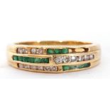 Emerald and diamond set half hoop ring, an Art Deco design of three bands of channel set diamonds