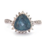 Modern 9ct white gold and apatite ring, heart shaped, within a small diamond surround and