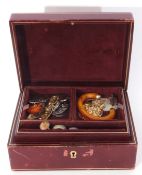 Red leather jewel box and contents, to include rings, brooches, bracelets etc