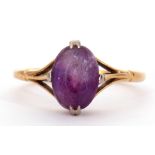 18ct stamped amethyst ring, cardinal set and raised between openwork shoulders, size K/L