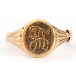 18ct stamped gents signet ring, the oval panel engraved with a monogram "JW" between engraved