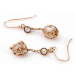 Pair of antique baroque pearl drop earrings, each with a boulder shape pearl in a beaded strap