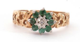 9ct gold emerald and diamond cluster ring, centring a small diamond in an illusion setting raised