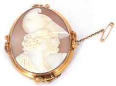 Victorian oval carved shell cameo depicting a centurion, 6 x 5cm, in a yellow metal frame (tests for