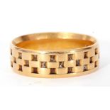 18ct gold wedding ring engraved with a chequerboard design, size O/P, 5.4gms