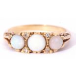 18ct gold opal and diamond ring featuring three graduated round cut cabochon opals, with four