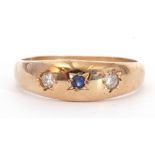 9ct gold diamond and sapphire ring, centring a small round sapphire flanked by two small brilliant