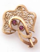 9ct gold open work spray brooch highlighted with two small round cut rubies, 5.8gms