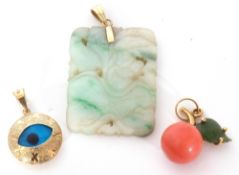 Mixed Lot: carved jade pendant suspended from a 14K stamped bale, a 585 stamped pendant with a