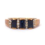 9ct gold, blue coloured stone and paste set ring, the design featuring three rectangular shaped