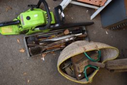 Chainsaw along with a group of hand tools