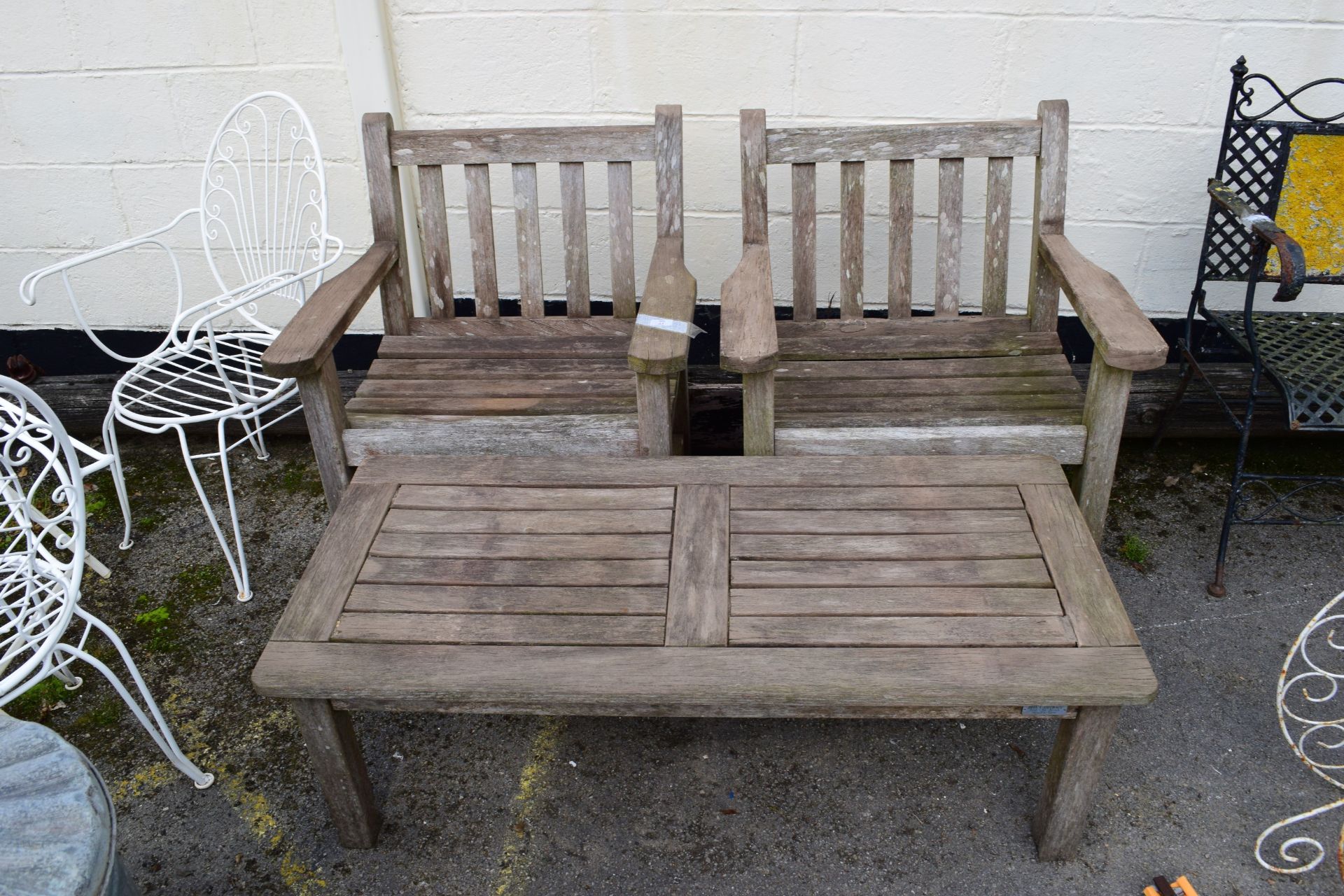 PAIR OF WOODEN GARDEN SEATS WITH A COFFEE TABLE
