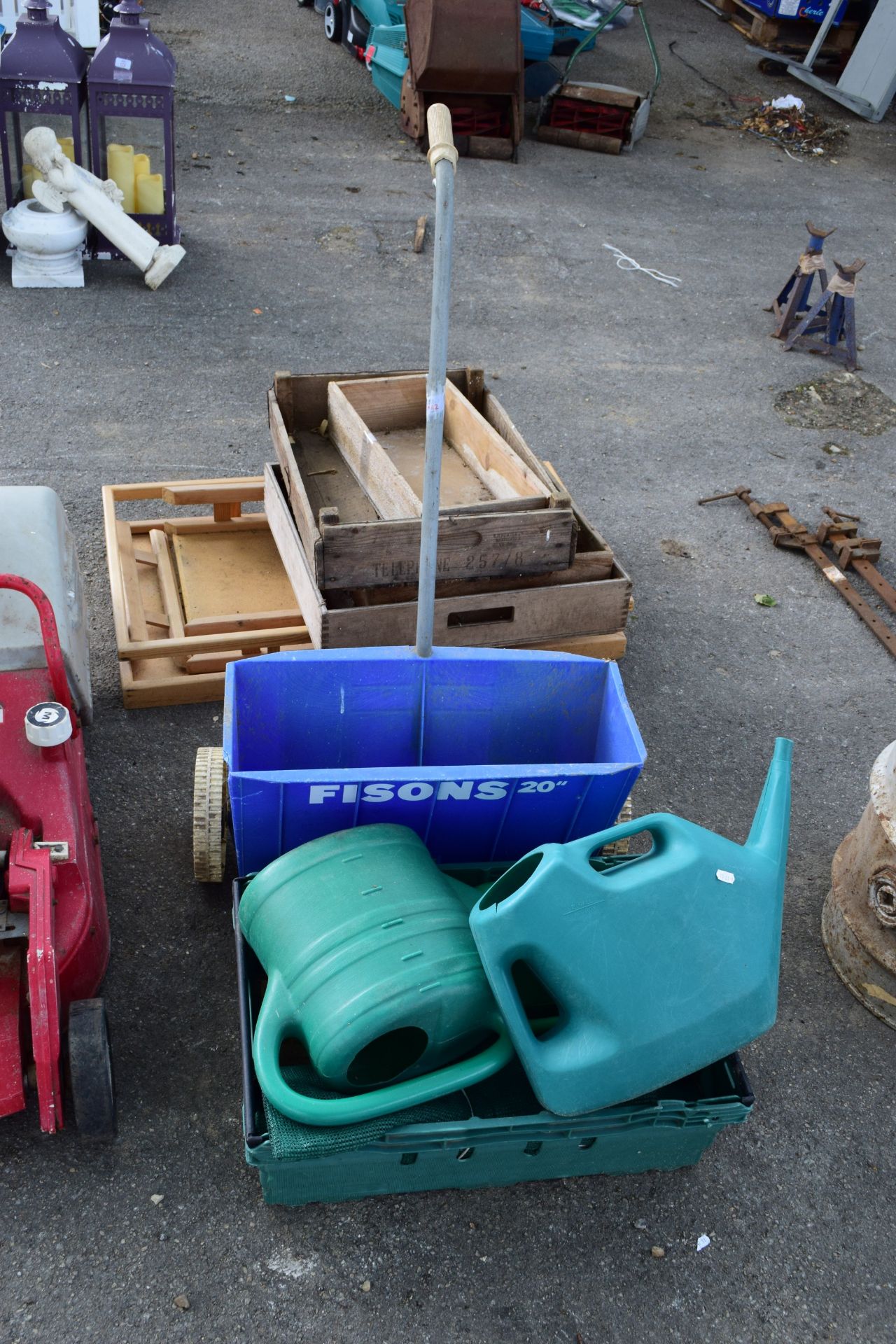 BOX CONTAINING QTY OF WATERING CANS AND JERRY CAN, PLUS A GARDEN SEED SPREADER