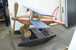 Modern large child's rocking toy modelled as a bi-plane in blue, red and white livery, 94cm long