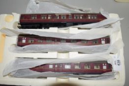 Group of three Hornby 00 gauge coaches including The Caledonian, in styrofoam case (missing cover)