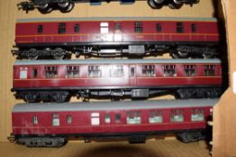 Group of three 00 gauge coaches in red livery to include Triang and Lima