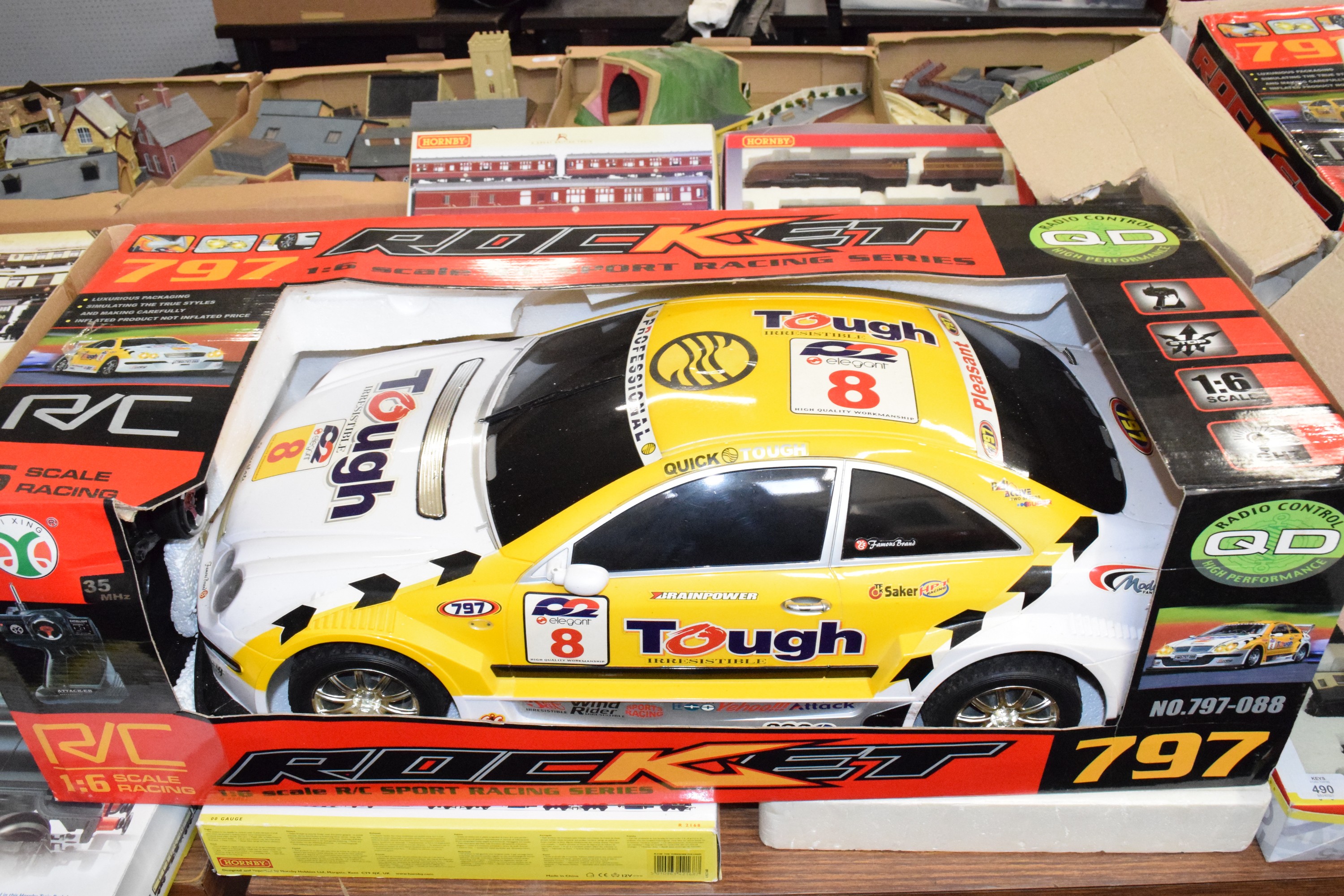 Boxed Rocket 16L RC sport racing car in yellow and white livery