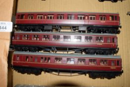 Group of three unboxed 00 gauge Bachmann coaches in red livery