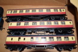Group of three unboxed 00 gauge Hornby coaches in red and cream livery