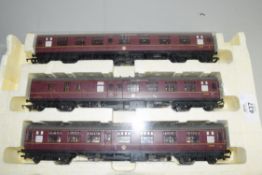 Group of three Hornby 00 gauge coaches to include The Norfolkman, in styrofoam case (cover missing)