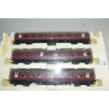 Group of three Hornby 00 gauge coaches to include The Norfolkman, in styrofoam case (cover missing)