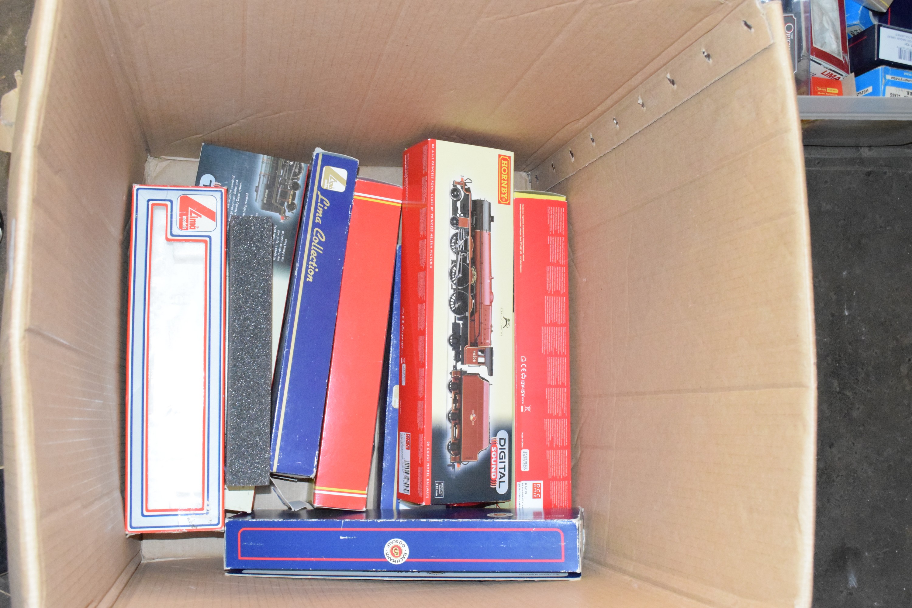 Box containing eight empty Hornby and Lima 00 gauge railway boxes