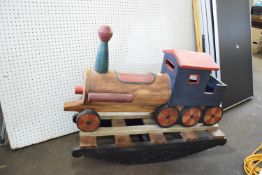 Large wooden child's rocking toy modelled as a locomotive in red and blue livery, 89cm long