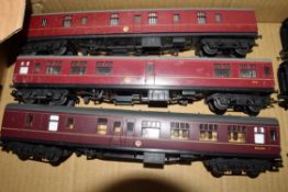 Group of three unboxed 00 gauge coaches to include Triang and Lima in red livery