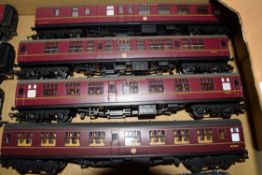 Group of four 00 gauge coaches by Hornby and one Lima in red livery