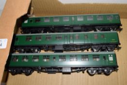 Group of three unboxed 00 gauge Bachmann coaches in green livery