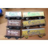 Group of six unboxed 00 gauge goods wagons to include Carlsberg branded etc