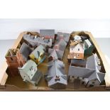Group of card models of buildings including High St shop, church, terraced houses etc
