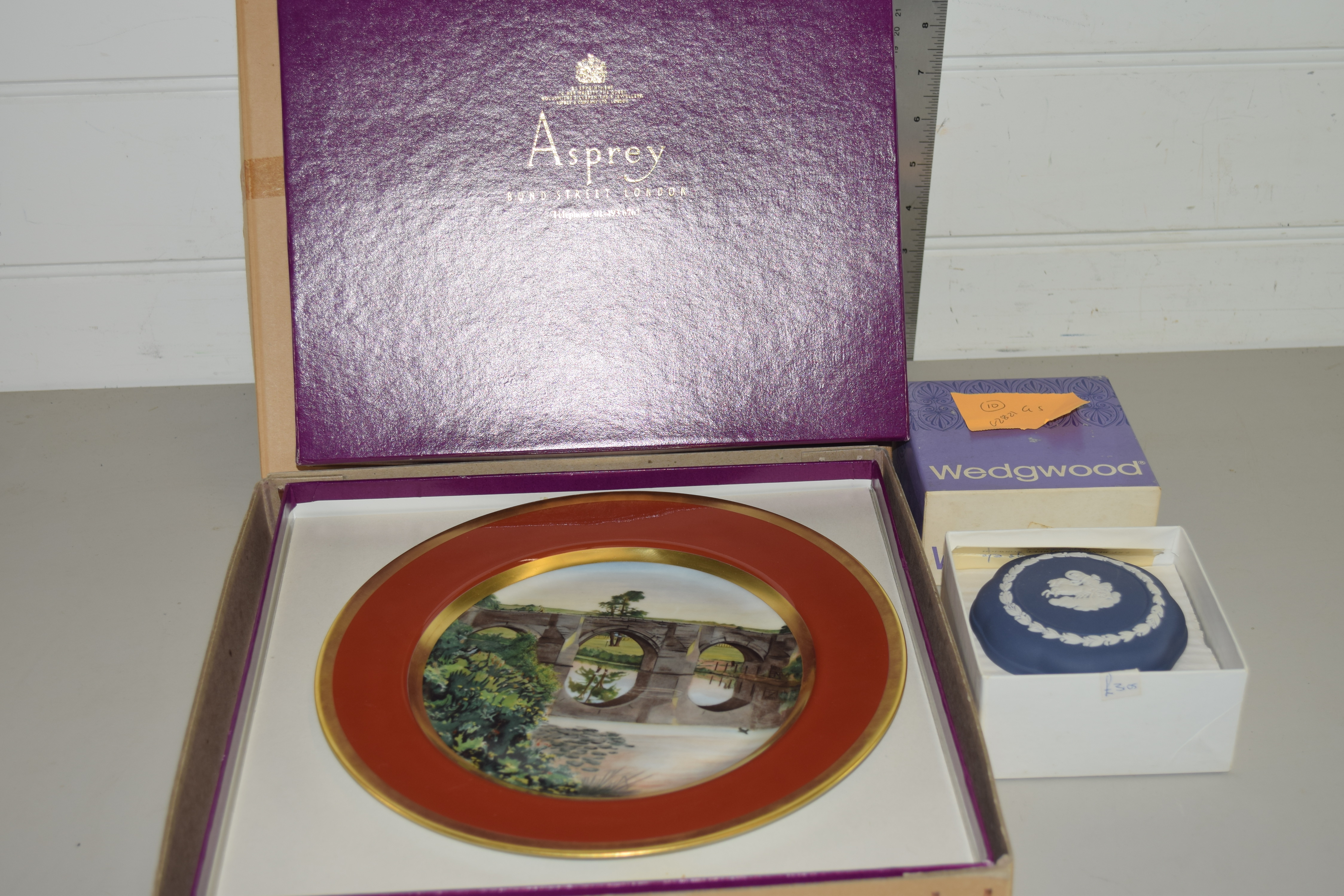 LIMITED EDITION LIMOGES PLATE IN ASPREY BOX PRODUCED FOR REED MEDWAY SAXE LTD AND A WEDGWOOD TRINKET