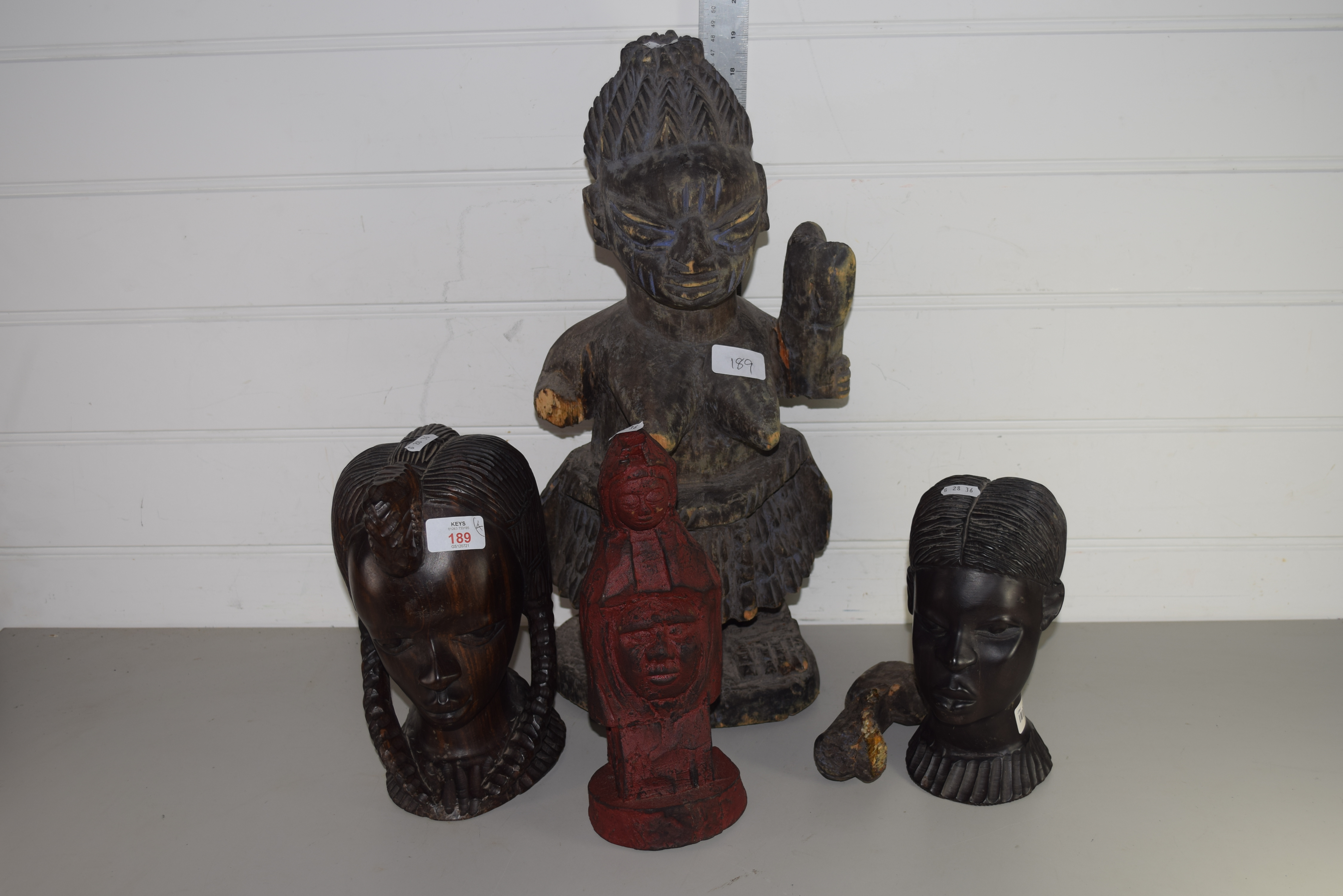 COLLECTION OF FOUR TRIBAL ART HEADS, PROBABLY WEST AFRICAN