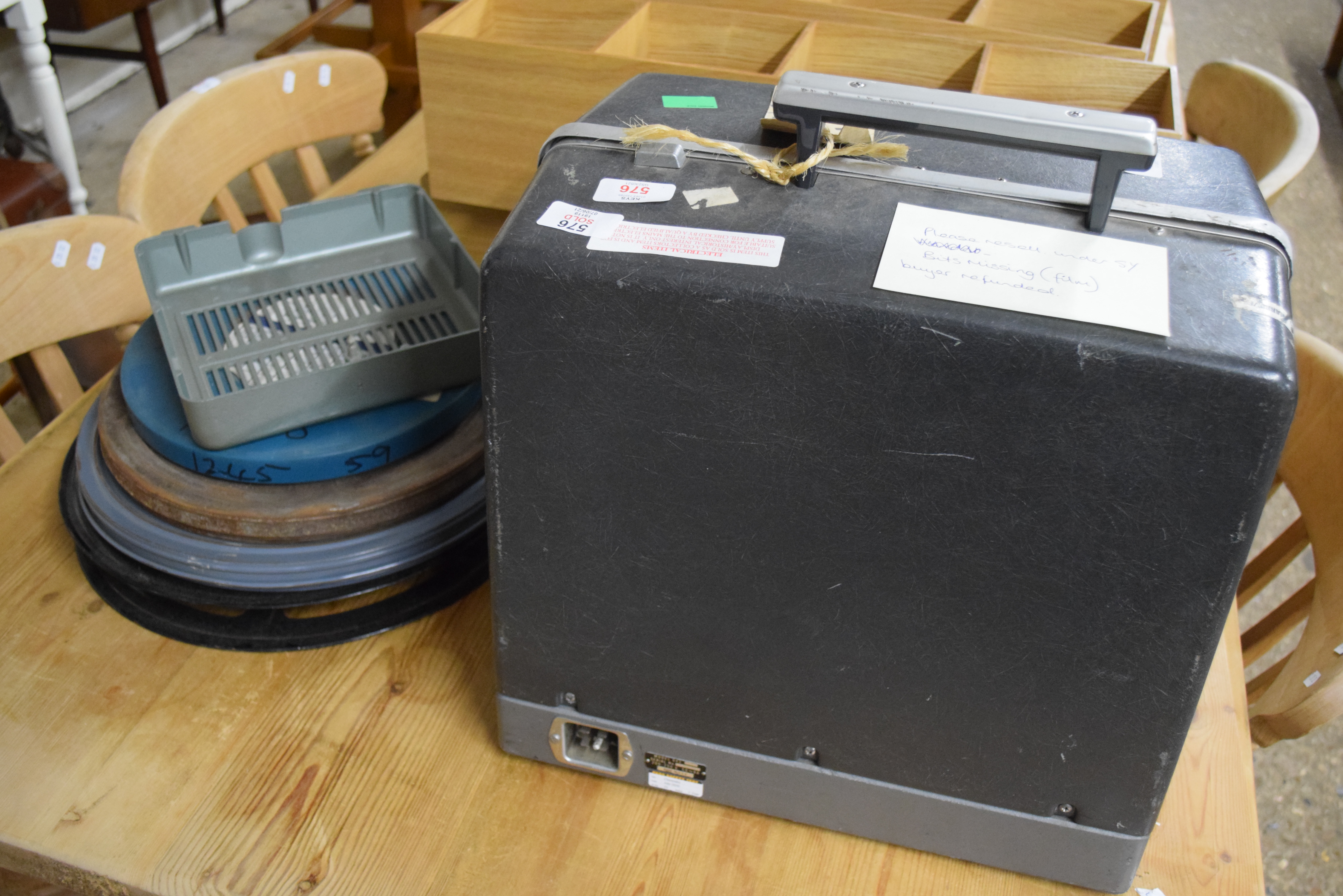 CASED BELL & HOWELL 16MM FILM PROJECTOR AND REELS ETC