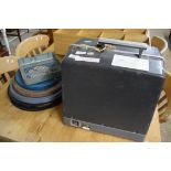 CASED BELL & HOWELL 16MM FILM PROJECTOR AND REELS ETC