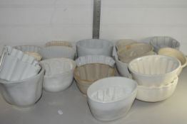 BOX CONTAINING GLAZED CERAMIC JELLY MOULDS