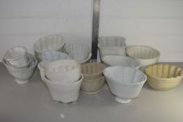 LARGE TRAY CONTAINING CERAMIC JELLY MOULDS