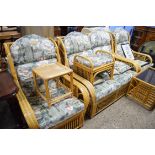 CANE CONSERVATORY SUITE COMPRISING TWO-SEATER SOFA, TWO CHAIRS, STOOL, COFFEE TABLE AND OCCASIONAL