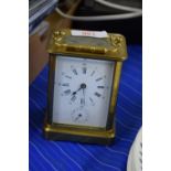 SMALL BRASS AND GLASS CARRIAGE CLOCK