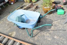 wheelbarrow and watering can