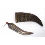 Jambiya dagger lacking handle, together with brass ornate curved sheaf (a/f)