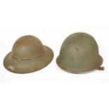 WWII Civil Defence Zuckerman helmet together with further Argentinian M1 helmet (a/f)