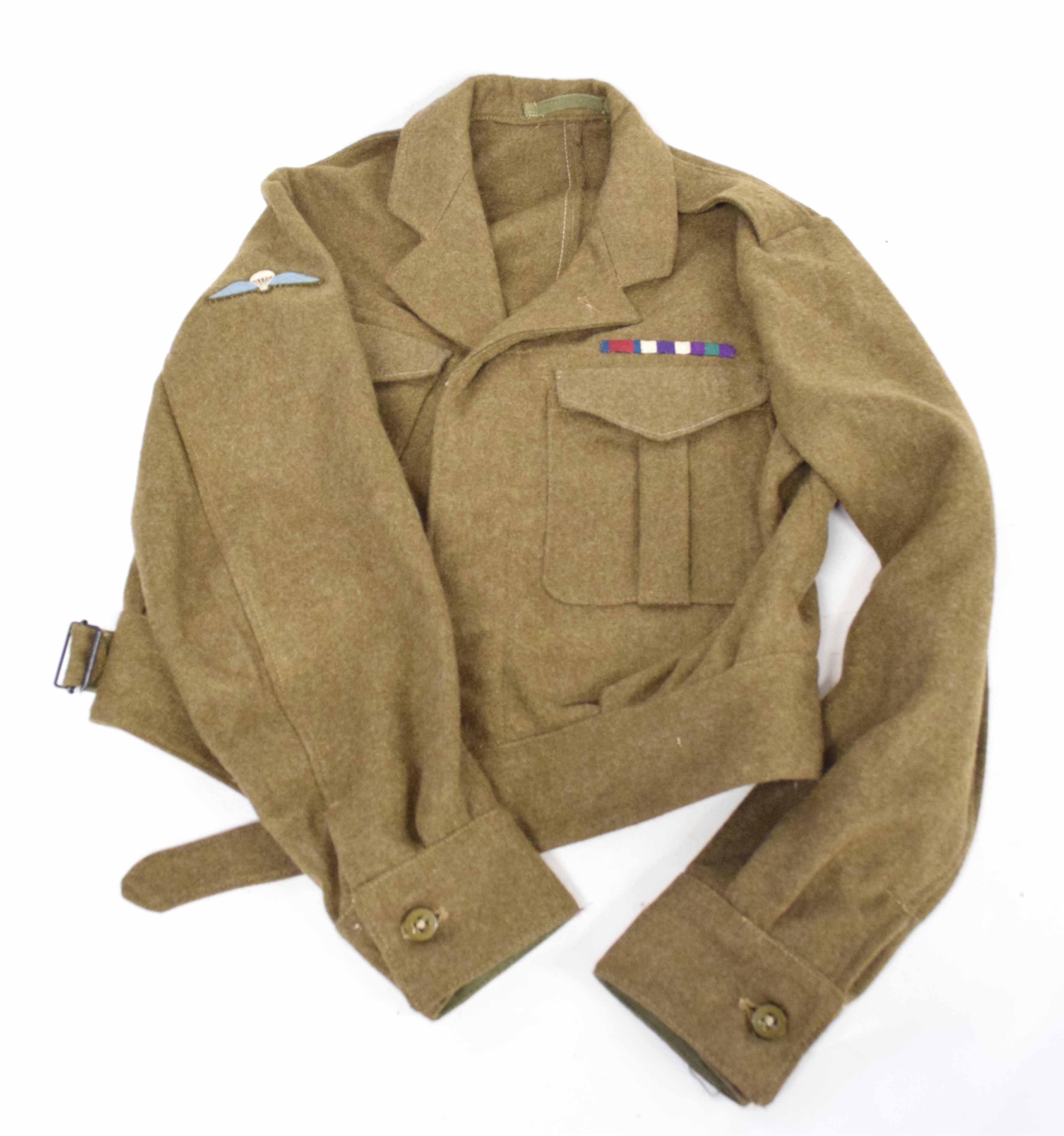 Battle dress blouse with parachute wings, medal ribbons for DSO, MC, GSM, blouse lacking label