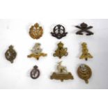 Quantity of ten British military cap badges to include Royal Machine Gun Corps, Royal