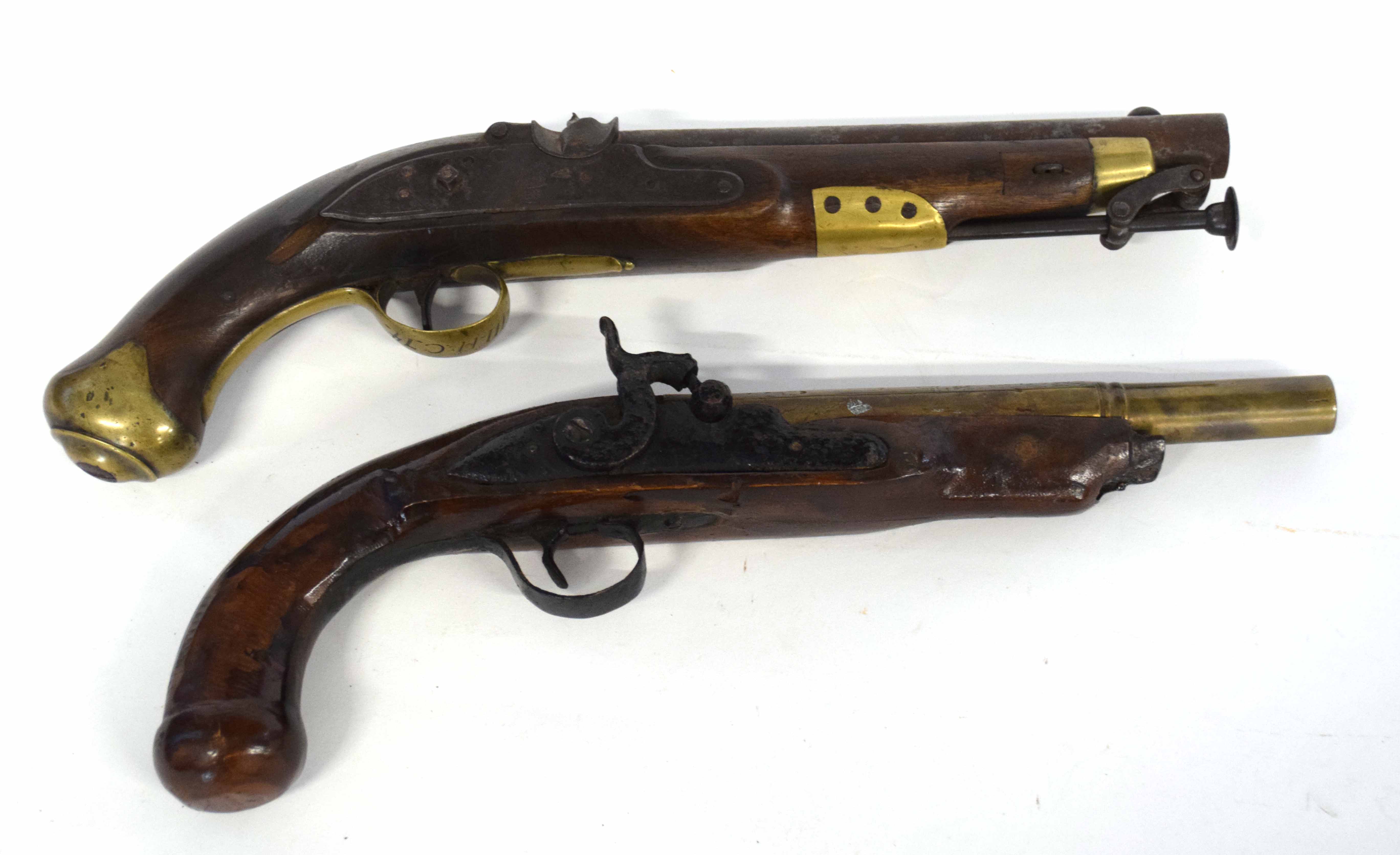 Two pistols, one Georgian Tower flintlock pistol converted to percussion cap, with brass butt cap,