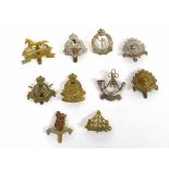 Quantity of ten 20th century British Military cap badges to include Army Cyclist Corps,